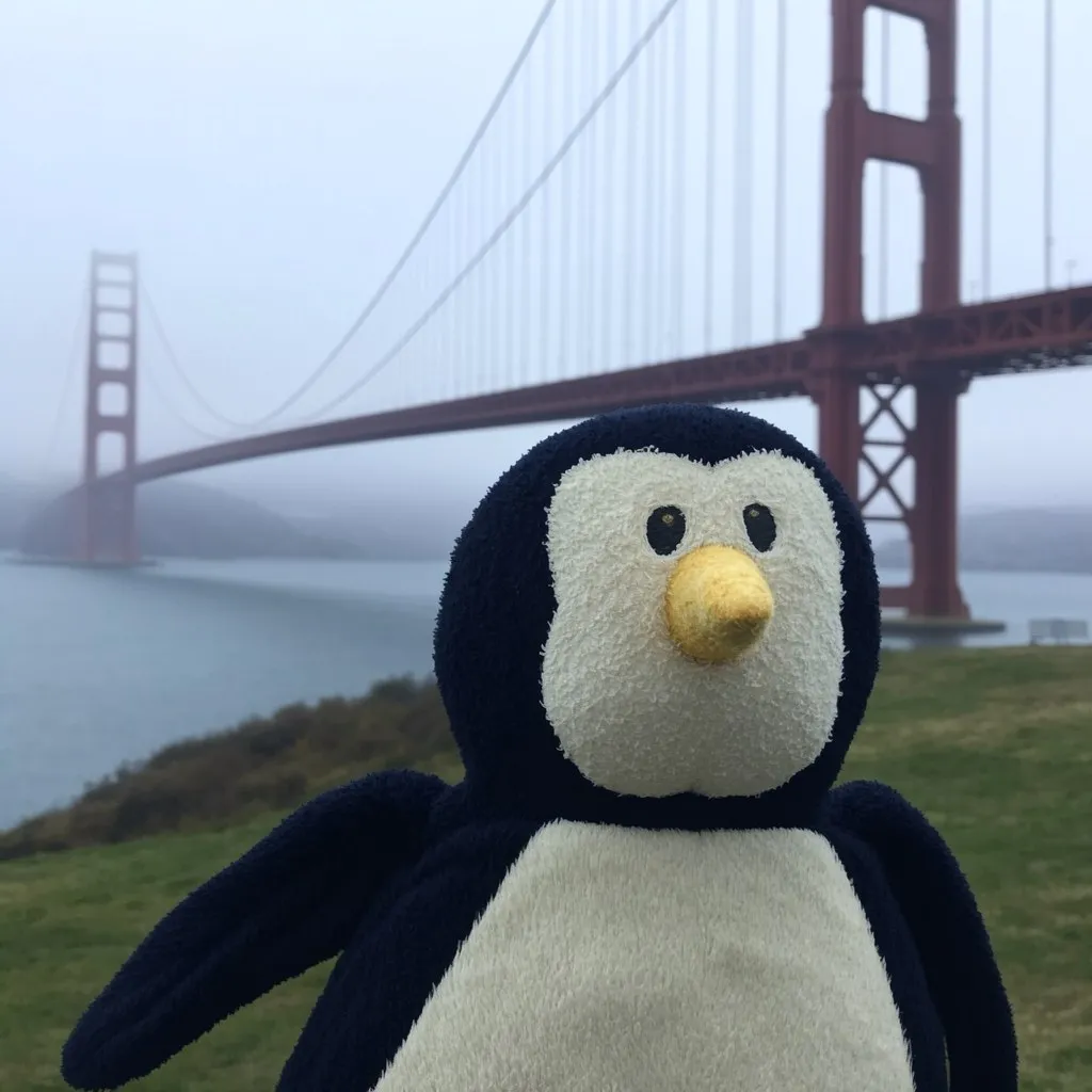 AI-generated photo of Penguinoh in front of the Golden Gate Bridge